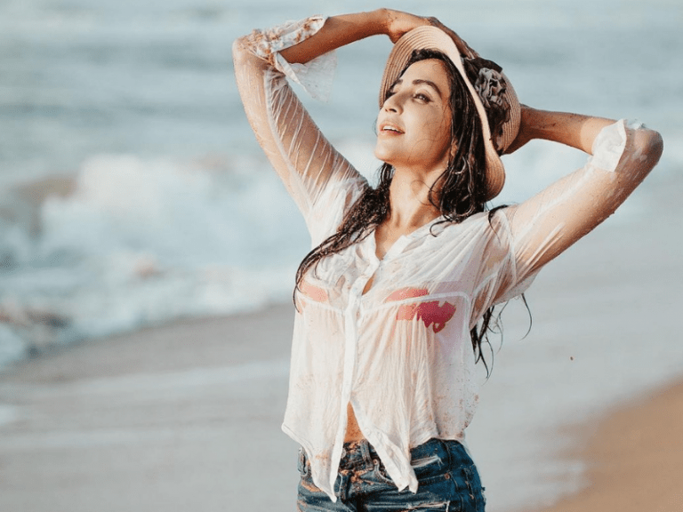 actor parvathi nair glamorous hot pics in  wet clothes on the beach